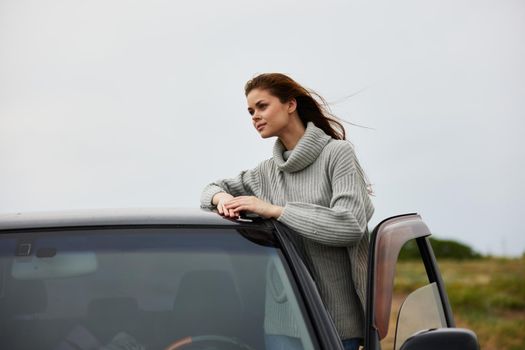 pretty woman near car travel nature trip Relaxation concept. High quality photo