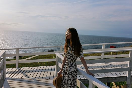 woman Walk near the hotel sea travel luxury unaltered. High quality photo