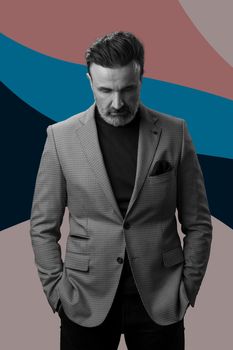 Black and white portrait of a stylish elegant senior businessman with a beard and casual business clothes against retro colorful pattern design background gesturing with hands. High quality photo