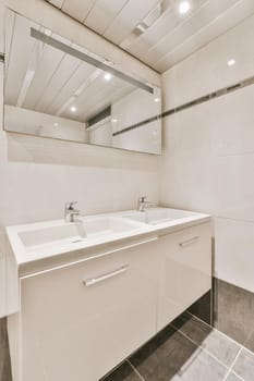 Impeccable bathroom with modern sink and large mirror