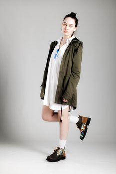 Full body shot of a fashionable young woman with cool clothes.