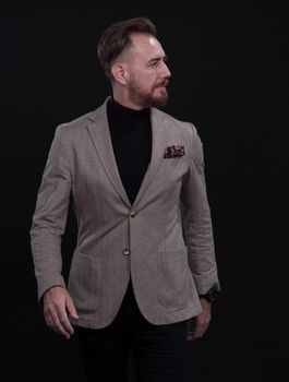 Confident businessman walking forward wearing a causal suit, handsome senior business man hero shot portrait isolated on black. High quality photo