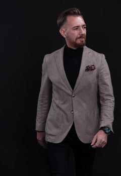 Confident businessman walking forward wearing a causal suit, handsome senior business man hero shot portrait isolated on black. High quality photo