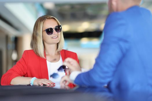 Portrait of stylish female on meeting with consultant to get advice on subject. Successful people talk about strategy. Business meeting, planning concept