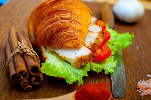 savory croissant brioche bread with chicken breast and vegetable rustic style 