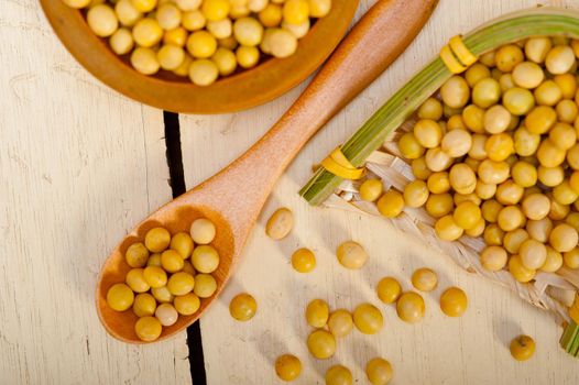 organic soya beans over rustic wood table macro closeup