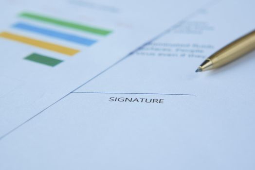 close up of signature on a contact on table ,