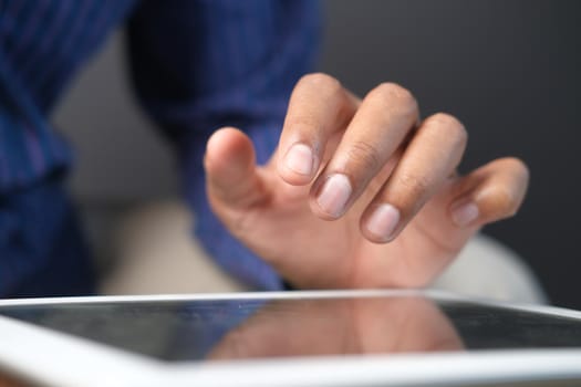 businessman using digital tablet on office desk .