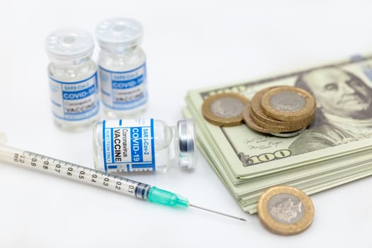 Cash money with Covid Vaccine for buying Anti Coronavirus medicine cost concept.