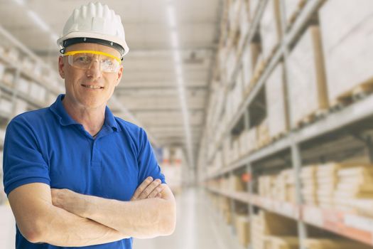 Warehouse inventory store staff worker man employee smart standing smile with space for text.
