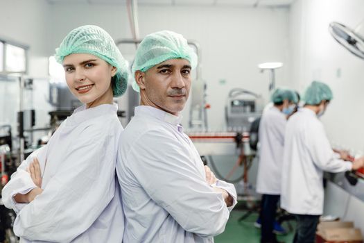 Portrait team worker staff labor working in food factory standing looking camera happy smile.