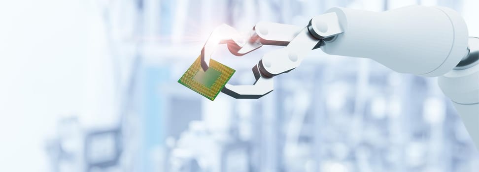 Robot arm handle Computer Microprocessor chip for advance technology production business in modern factory concept.