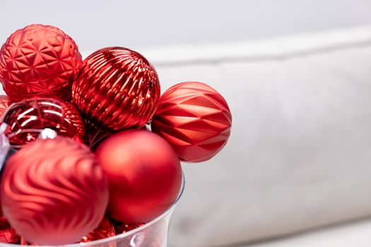 Red Hydrangeas in a Silver Vase with Red Christmas Balls Out of Focus in Background