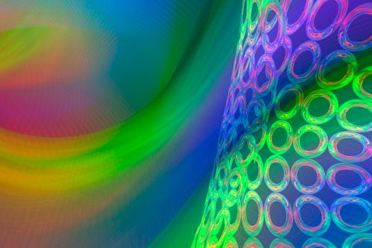 A beautiful rainbow background with an iridescent grid of rings.