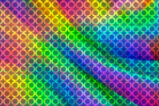 A beautiful rainbow background with an iridescent grid of rings.