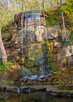 Waterfall in the Sofievsky arboretum or Sofiyivsky Park in Uman, Ukraine, on a sunny autumn day