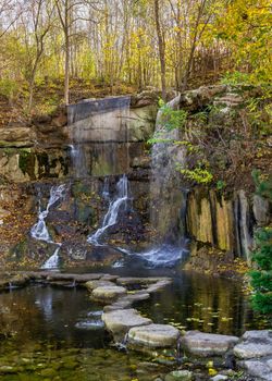 Waterfall in the Sofievsky arboretum or Sofiyivsky Park in Uman, Ukraine, on a sunny autumn day