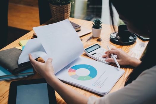 Business woman looking at charts, spreadsheets, graph financial development, bank accounts, statistics, economy, data analysis, investment analysis, stock exchange, business financial concept.