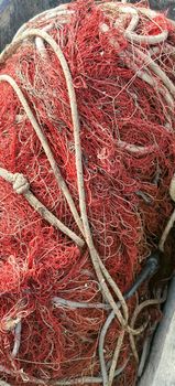 red fishing net collected in a basket. High quality photo