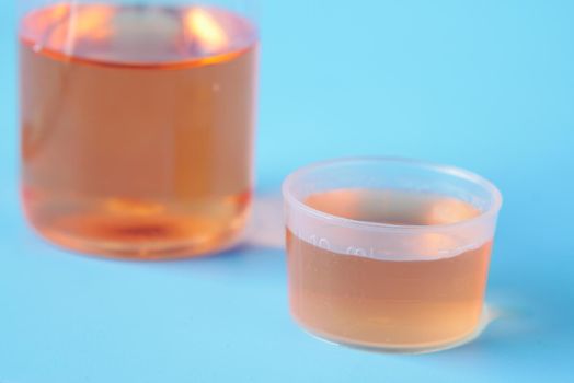 bottle with liquid medicine on white