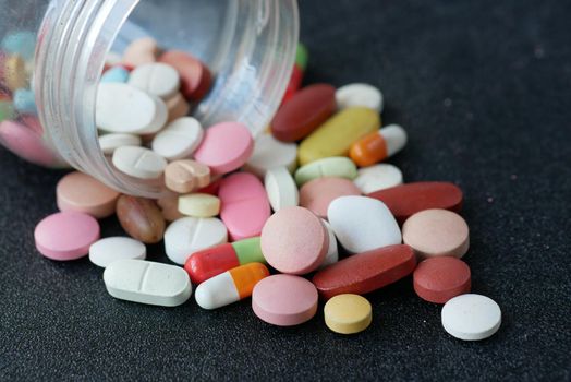 selective focus. Close up of many colorful pills and capsules .