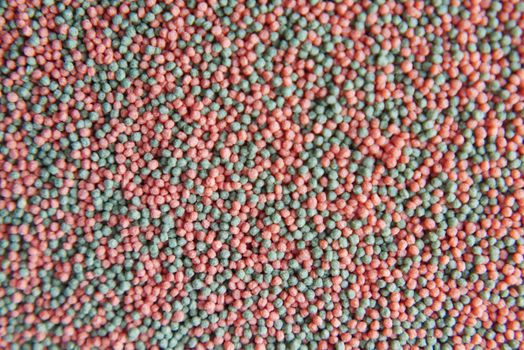 top view of pet fish food in a container .