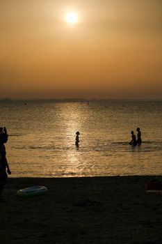 Rimini beach at sunset with yellow sky Riviera Romagnola. High quality photo