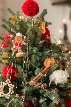 Beautiful Christmas tree decorated with gingerbread, dried oranges and cinnamon. Merry Christmas and New Year holidays background.