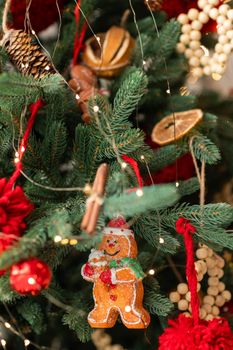 Beautiful Christmas tree decorated with gingerbread, dried oranges and cinnamon. Merry Christmas and New Year holidays background.