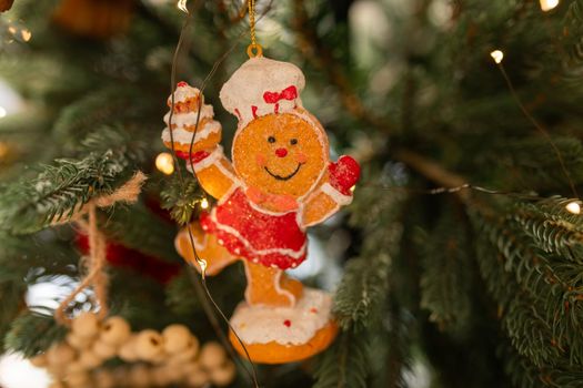 Beautiful Christmas tree decorated with gingerbread, dried oranges and cinnamon. Merry Christmas and New Year holidays background.