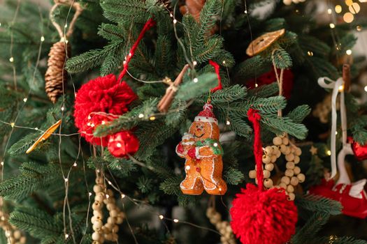 Beautiful Christmas tree decorated with gingerbread, dried oranges and cinnamon. Merry Christmas and New Year holidays background.