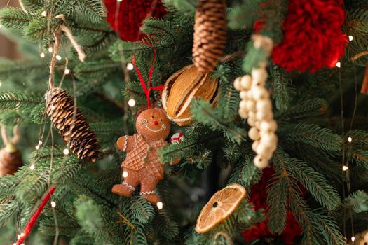 Beautiful Christmas tree decorated with gingerbread, dried oranges and cinnamon. Merry Christmas and New Year holidays background.