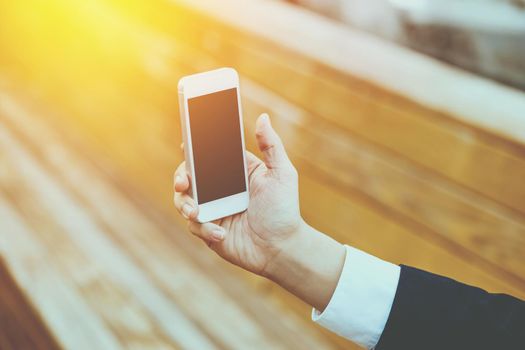 Business Concept - Young Business man check mobile phone for meeting.