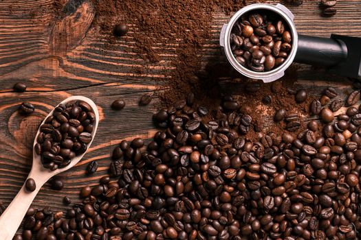 Coffee beans on wooden table texture with copy space. View from above. Still life. Flat lay. Mock-up