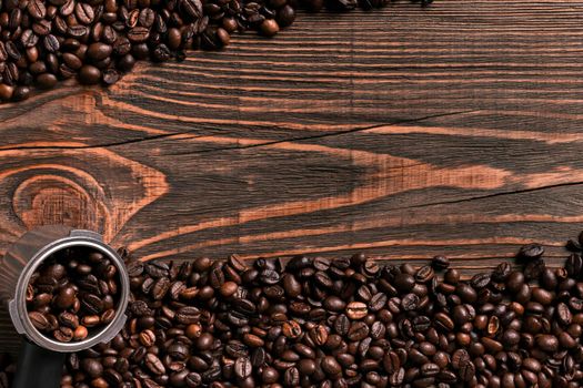 Coffee beans on wooden table texture with copy space. View from above. Still life. Flat lay. Mock-up