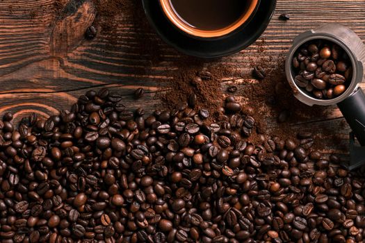 Coffee cup and beans frame on wooden table. Top view. Copy space. Still life. Mock-up. Flat lay