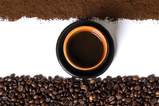 White background with cup of coffee, coffee beans and ground coffee on below and above. View from above with space for text. Still life. Mock-up. Flat lay