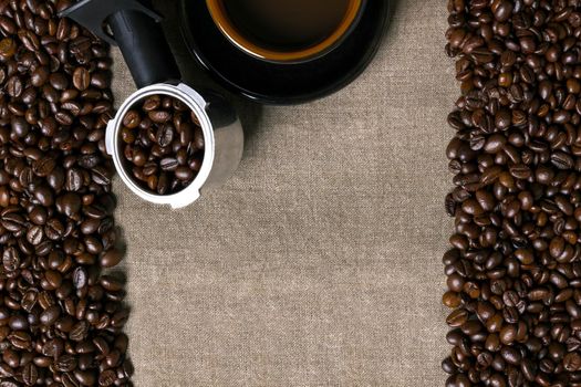 Coffee beans and Coffee cup on a burlap background. Top view. Copy space. Still life. Mock-up. Flat lay