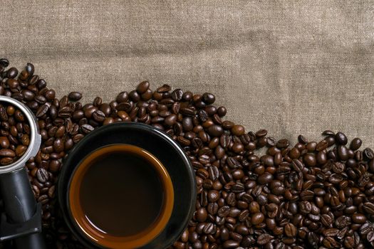 Coffee cup and coffee beans on wooden background. Top view. Still life. Copy space. Flat lay.