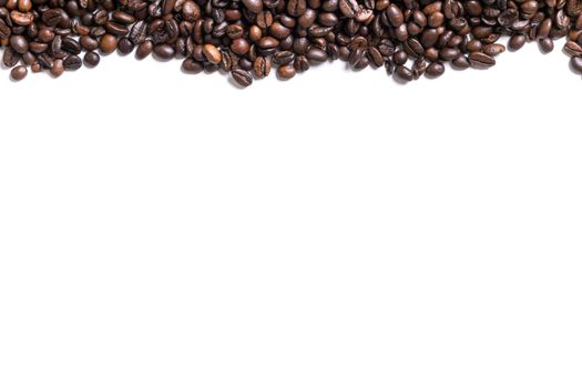 White background with coffee beans on the side. Top view. Still life. Copy space. Flat lay.