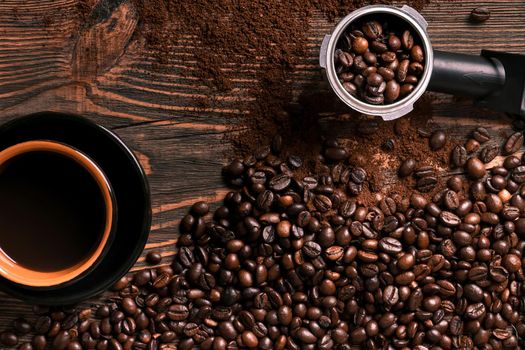 Coffee cup and beans frame on wooden table. Top view. Copy space. Still life. Mock-up. Flat lay