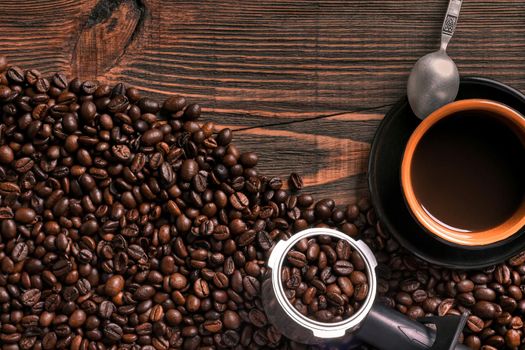 Coffee cup and beans frame on wooden table. Top view. Copy space. Still life. Mock-up. Flat lay