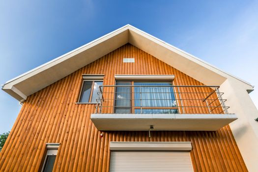 Beautiful wooden house. Facade of traditional homes and sky. at sunset and sunrise