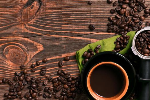 Coffee cup and beans frame on wooden table. Top view. Copy space. Still life. Mock-up. Flat lay