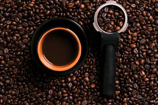 A cup of black coffee with coffee bean as background. Top view. Copy space. Still life. Mock-up. Flat lay