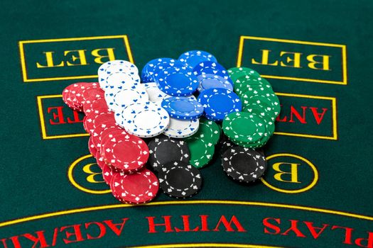 Poker play. Chips on the green table