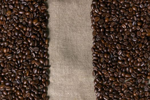 Coffee beans on burlap background. Top view. Copy space. Still life. Mock-up. Flat lay