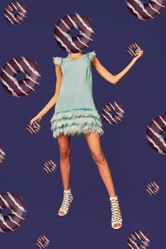 Abstract contemporary art. A woman's body with donut head on violet background. Modern style pop art zine culture concept