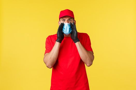 Express delivery during pandemic, covid-19, safe shipping, online shopping concept. Angry and shocked courier in medical mask and gloves, uniform, yelling at employee, warn person.