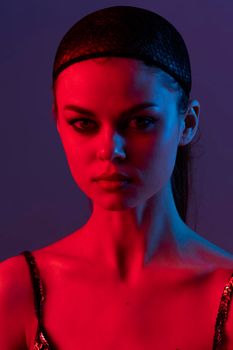 photo pretty woman black veil on the face close-up red light Lifestyle unaltered. High quality photo